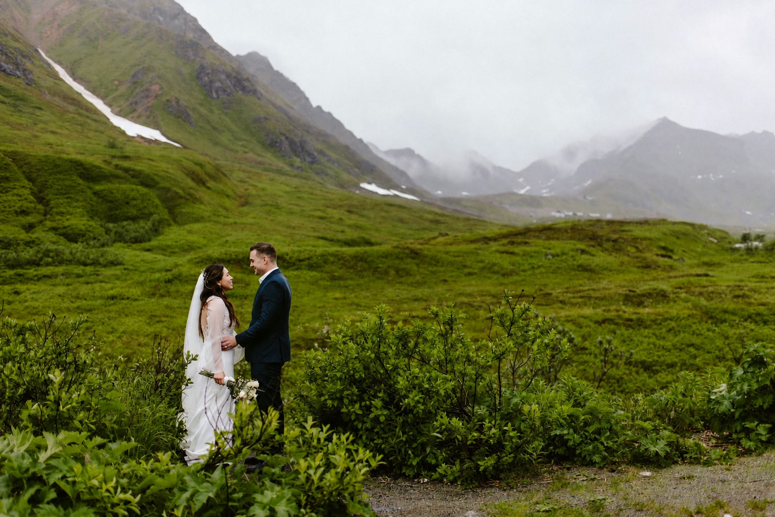 Nicolas and Chazlyn in an Alaskan mountain valley on their elopement day
